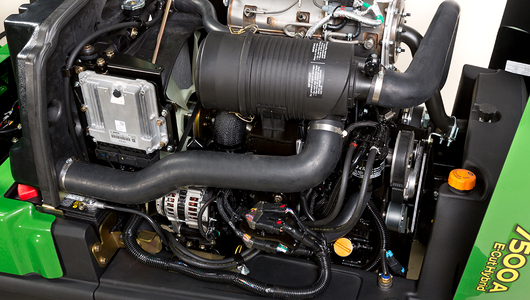 A close up of 7500A E-Cut™ Hybrid's 3-cylinder engine