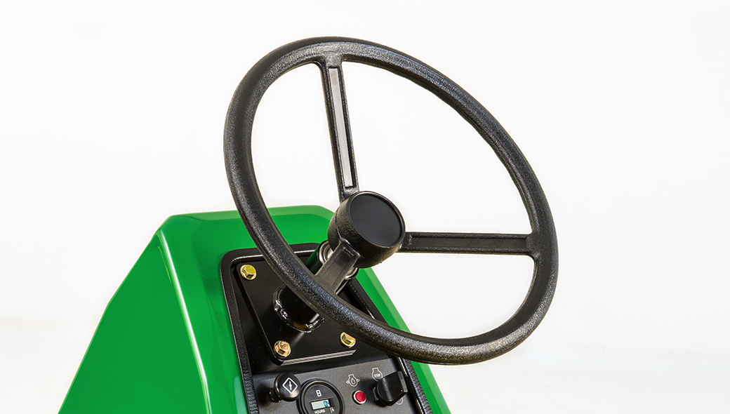 Close-up view of the steering wheel on the 1220 TruFinish Utility Rake
