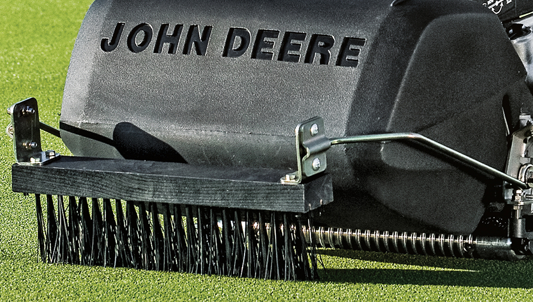 Close-up view of the brush on the 225 E-Cut Electric Walk Greens mower