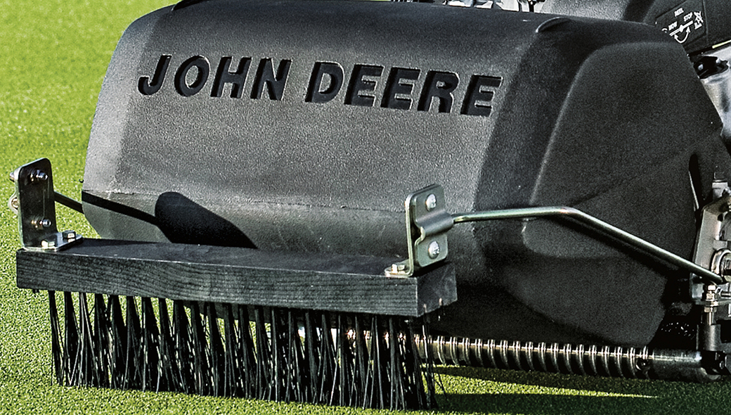 Close-up view of the brush on a 185 E-Cut Electric Walk Greens mower