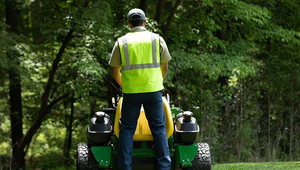 Man mowing with the QuikTrak Q865R EFI